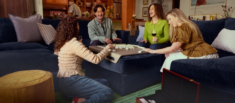 People enjoying a large Lovesac sectional couch