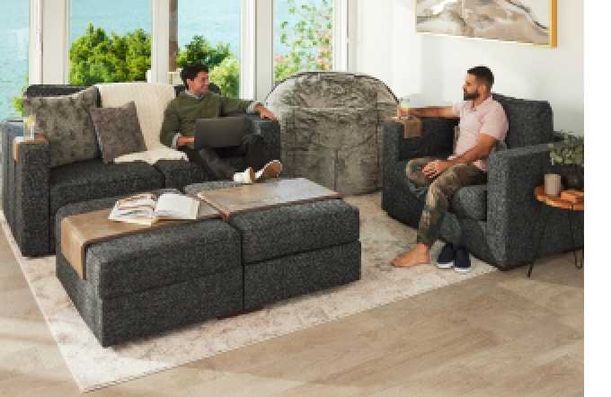 Two People on Lovesac Sactional and Chair in Living Room