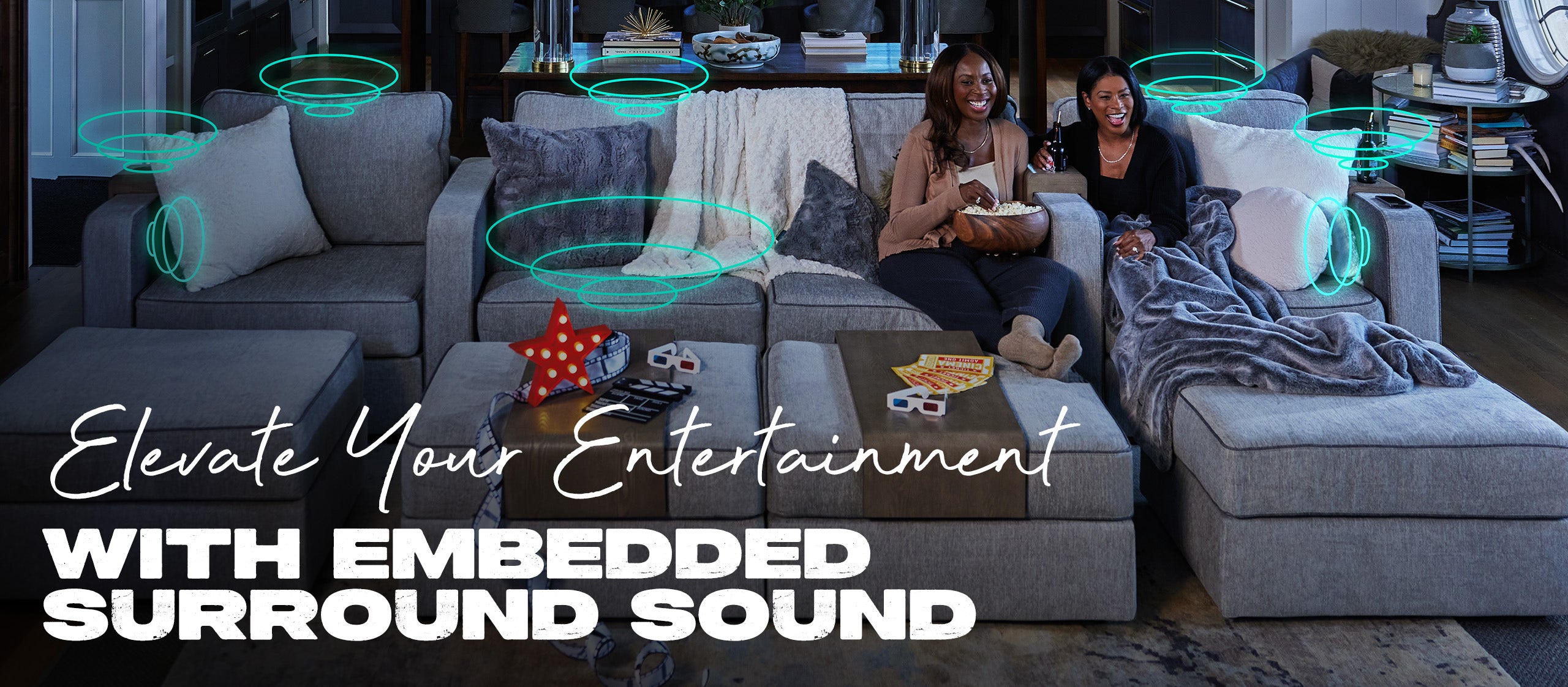 Two People Relaxing on Lovesac Sactional with StealthTech Surround Sound in Living Room