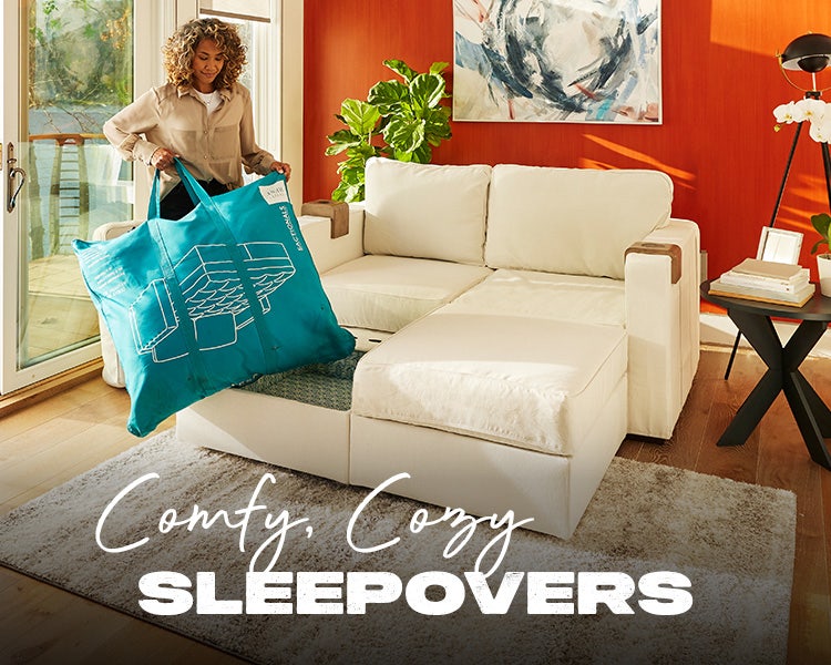 Woman Using Lovesac Guest Rest Bedding Kit on Lovesac Sactional