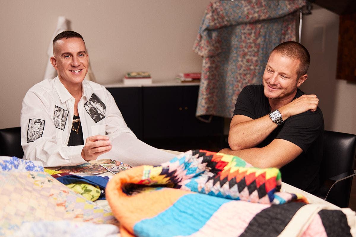 Jeremy Scott and Shawn Nelson smiling at the camera during a photo-shoot.
