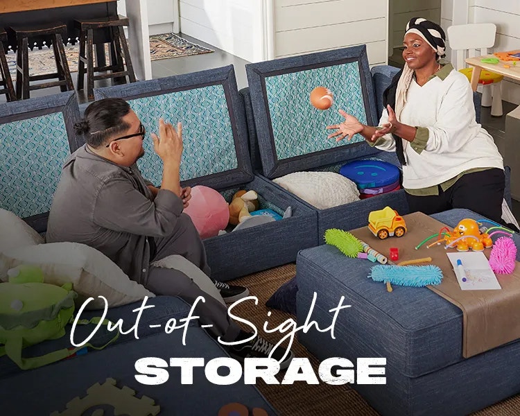 Partners Using Lovesac Sactional Storage Seat in Living Room