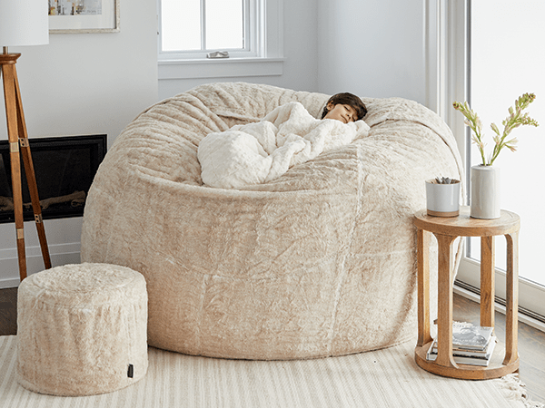 Boy happily napping in his Lovesac beanbag.