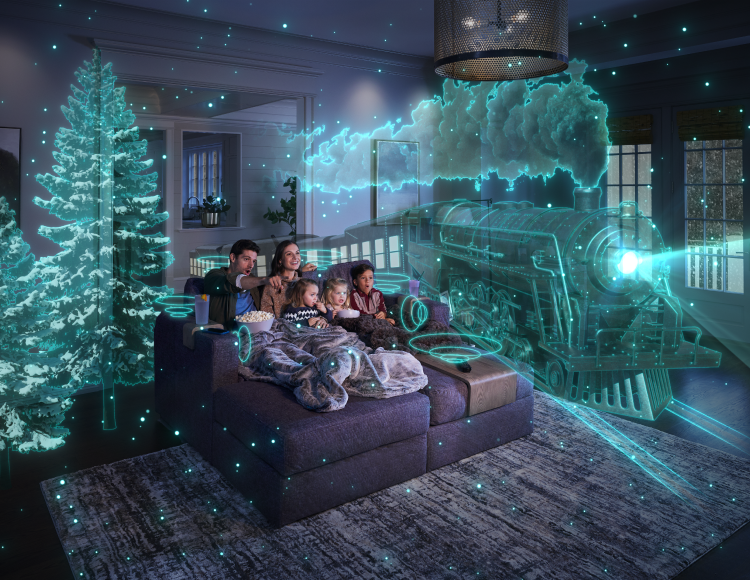 Family sitting on couch experiencing the StealthTech product