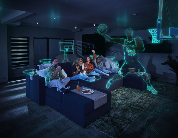 People lounging on a couch experiencing the StealthTech product