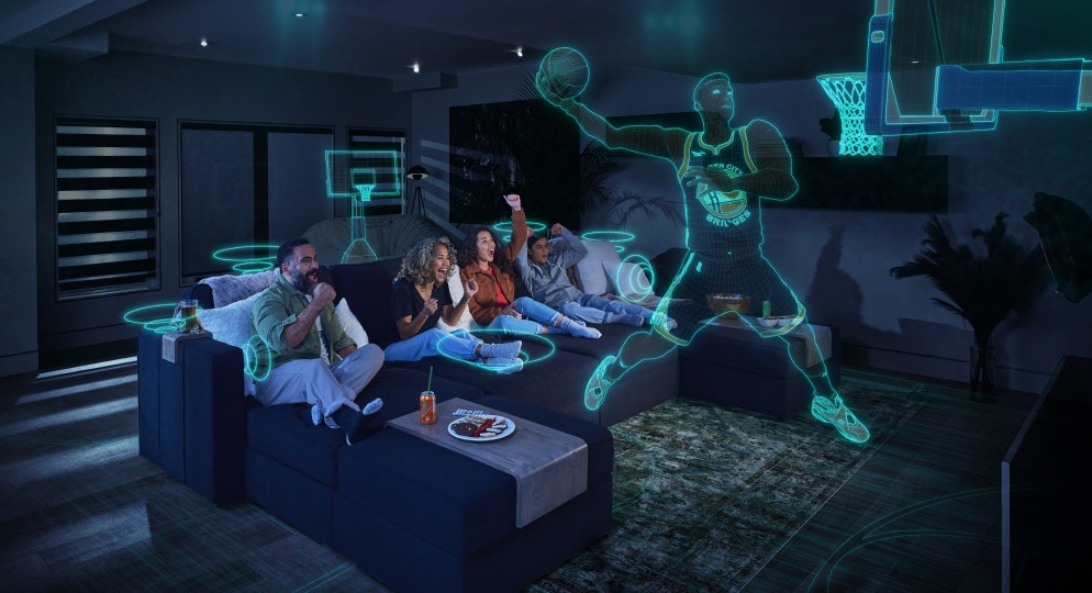 People lounging on a couch experiencing the StealthTech product