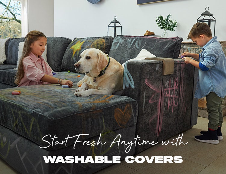 Kids and dog playing on Lovesac Sactionals couch with washable covers in living room