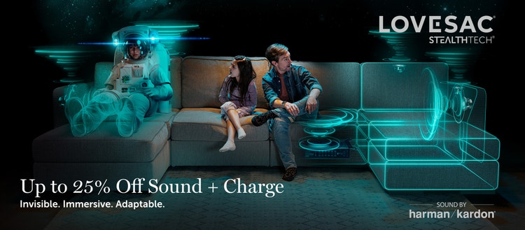 Man and child on a Lovesac sectional couch with embedded StealthTech speakers