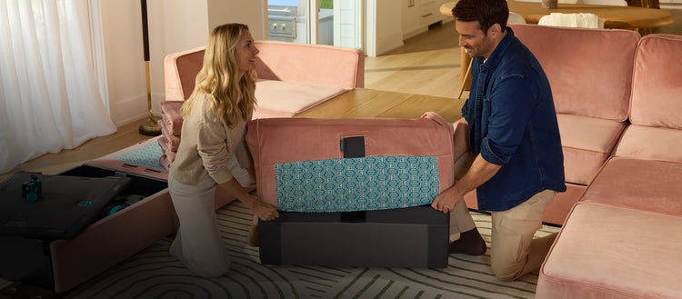 Couple enjoying their white Lovesac sectional couch with Reclining Seats