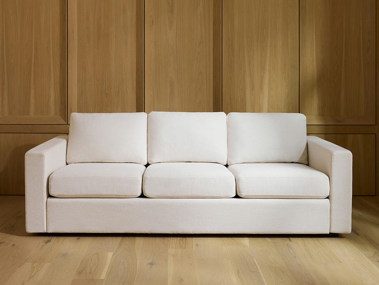 White, 3-cushion sofa with square arms in a living space