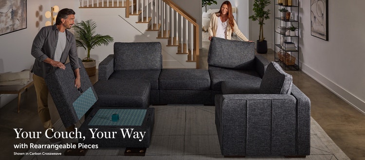 Couple setting up Lovesac sectional couch