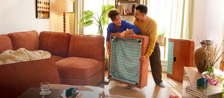 People rearranging their modular sectional couch