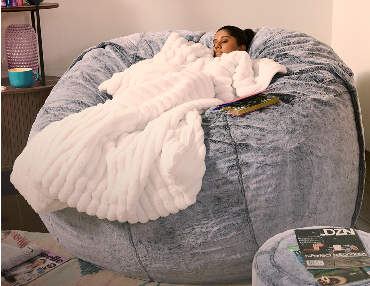 Women sleeping in giant bean bag