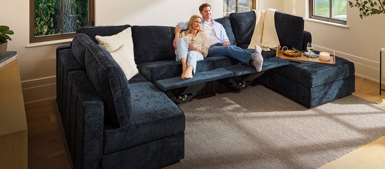 Family enjoying their blue Lovesac sectional couch