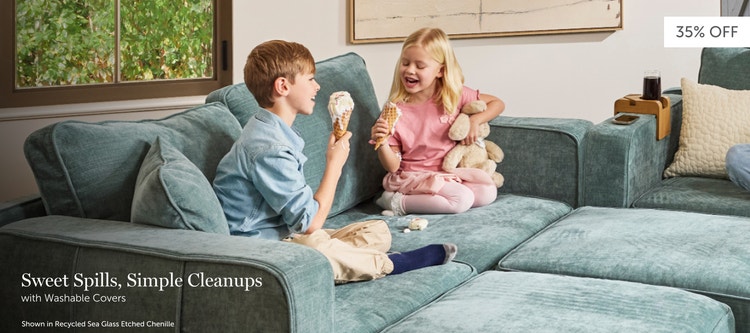 Children eating ice cream on a teal, Lovesac sectional couch