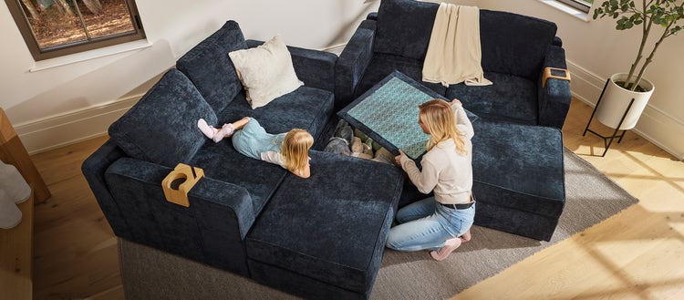 Couple enjoying their white Lovesac sectional couch with Reclining Seats